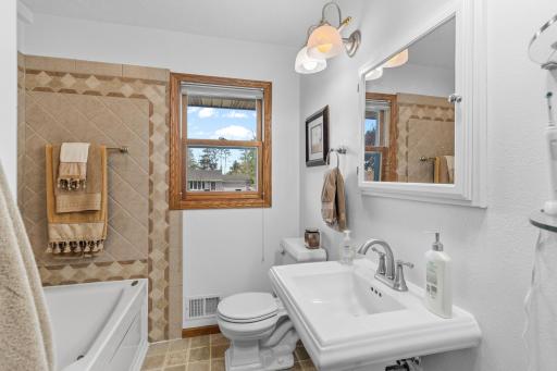 Main level full bathroom just off of bedroom 2 and 3.