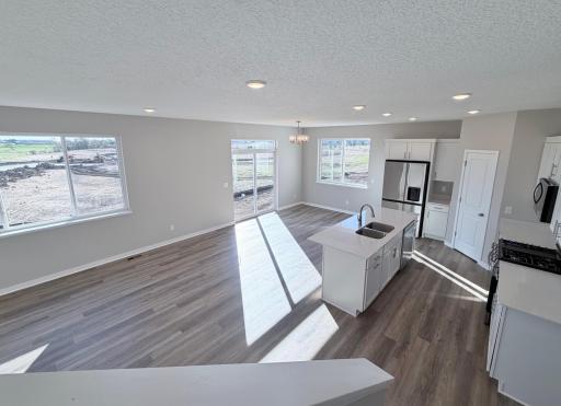 PHOTO OF A DIFFERENT HOME WITH SIMILAR PLAN. FINISHES MAY VARY.