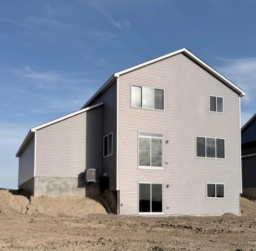 3171 Jandura Ave NE- Home features a walkout lower level to a spacious backyard. Sod and Irrigation System included.