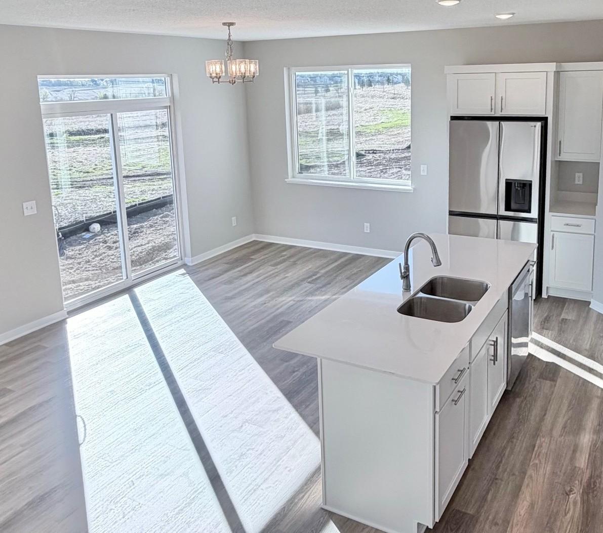 PHOTO OF A DIFFERENT HOME WITH SIMILAR PLAN. FINISHES MAY VARY.