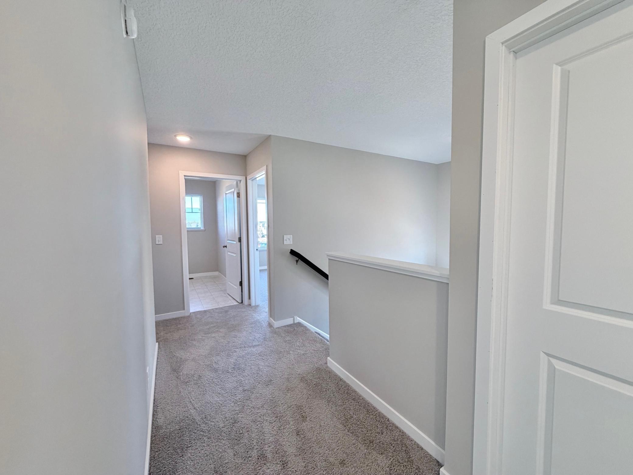 PHOTO OF A DIFFERENT HOME WITH SIMILAR PLAN. FINISHES MAY VARY.