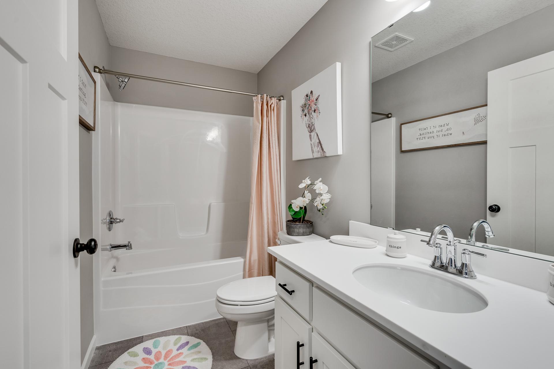 Photos are of a like home in different location. Options may be different in actual home. Actual home has no stone on the front.