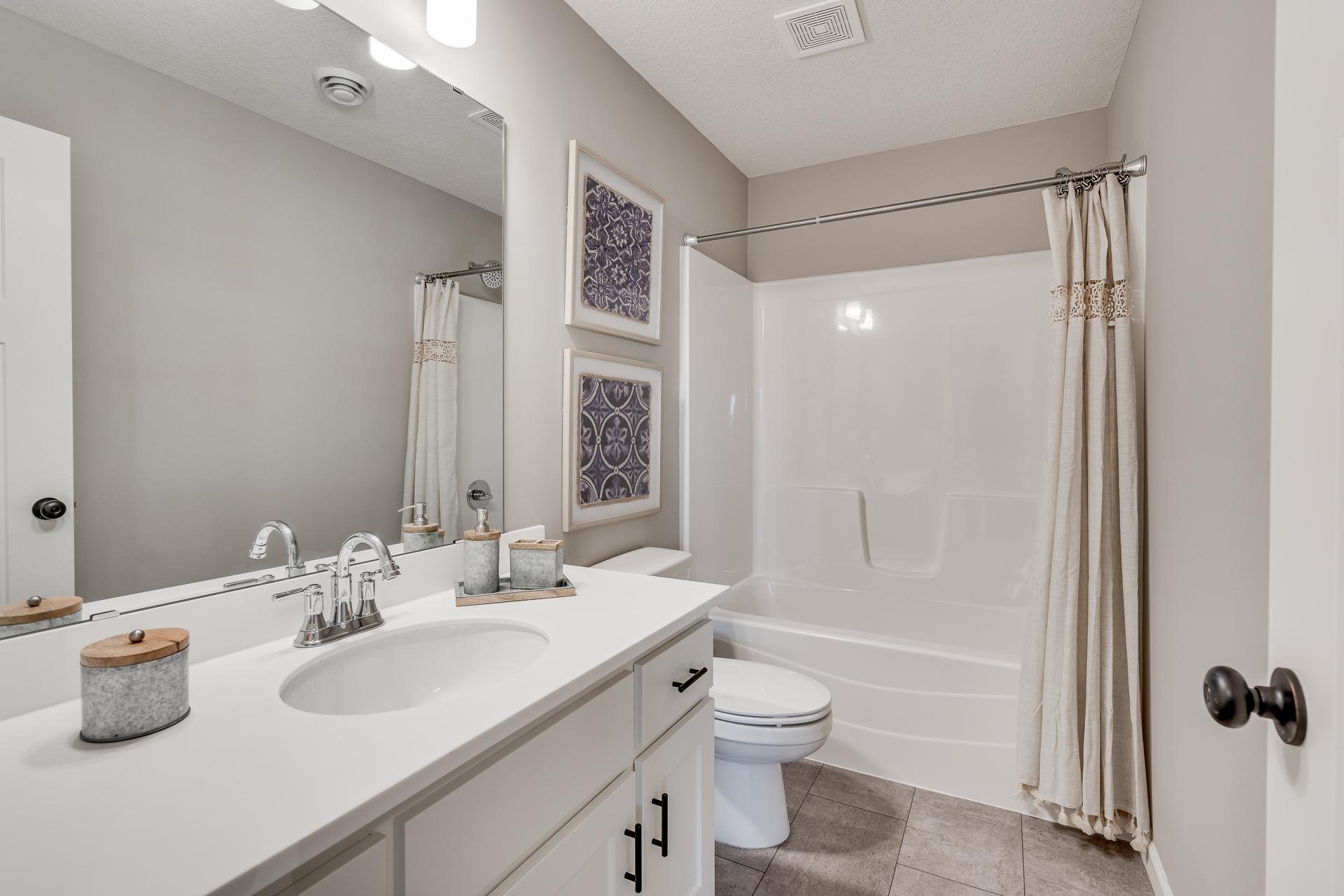 Photos are of a like home in different location. Options may be different in actual home. Actual home has no stone on the front.