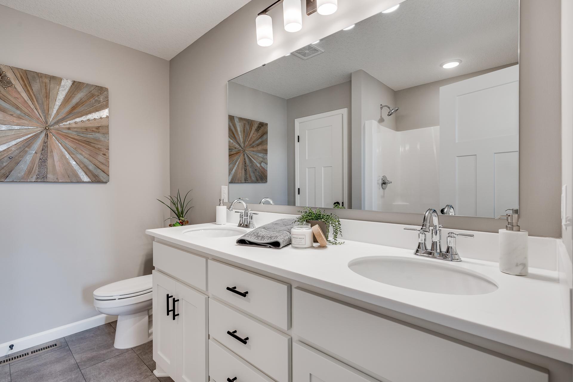 Photos are of a like home in different location. Options may be different in actual home. Actual home has no stone on the front.