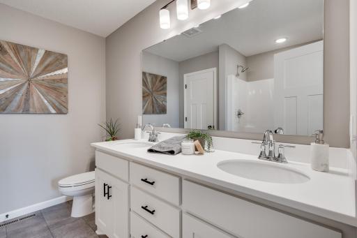 Photos are of a like home in different location. Options may be different in actual home. Actual home has no stone on the front.
