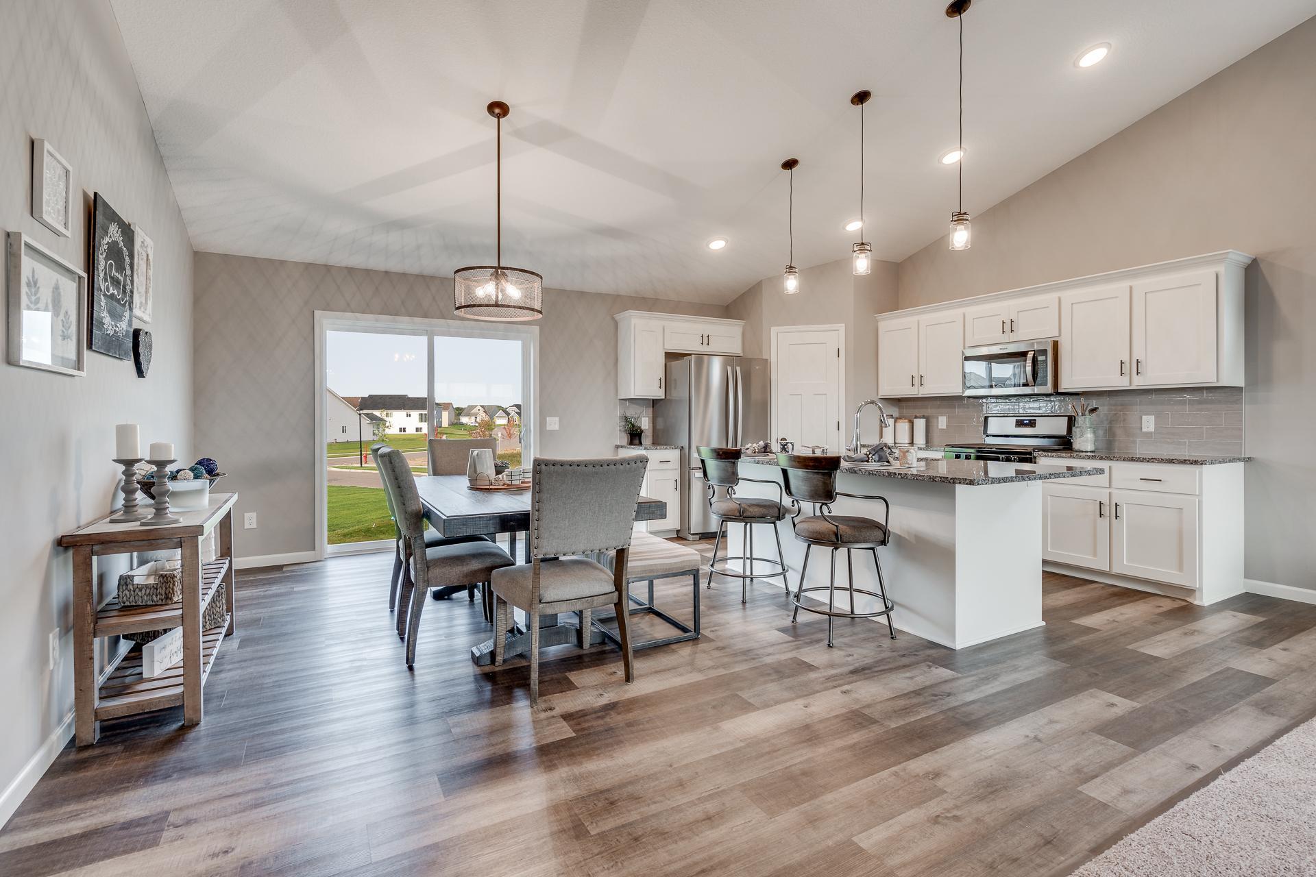 Photos are of a like home in different location. Options may be different in actual home. Actual home has no stone on the front.