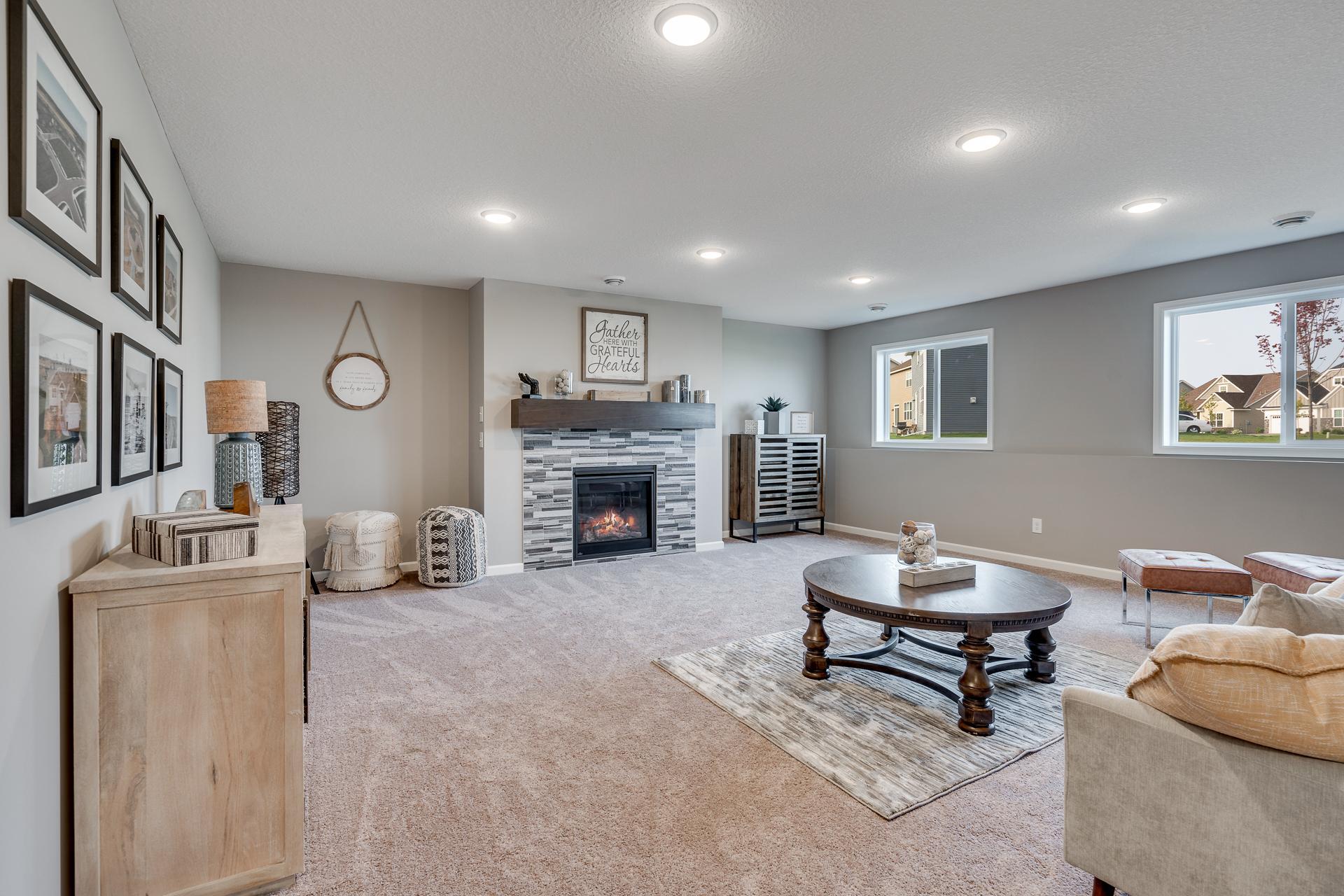 Photos are of a like home in different location. Options may be different in actual home. Actual home has no stone on the front.