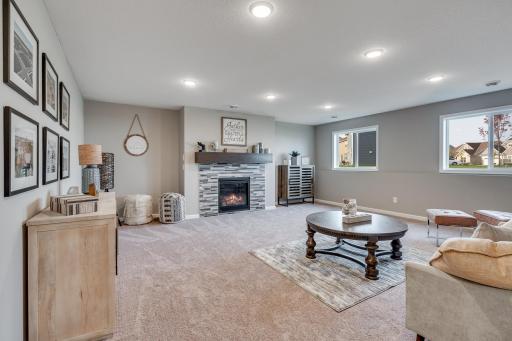 Photos are of a like home in different location. Options may be different in actual home. Actual home has no stone on the front.