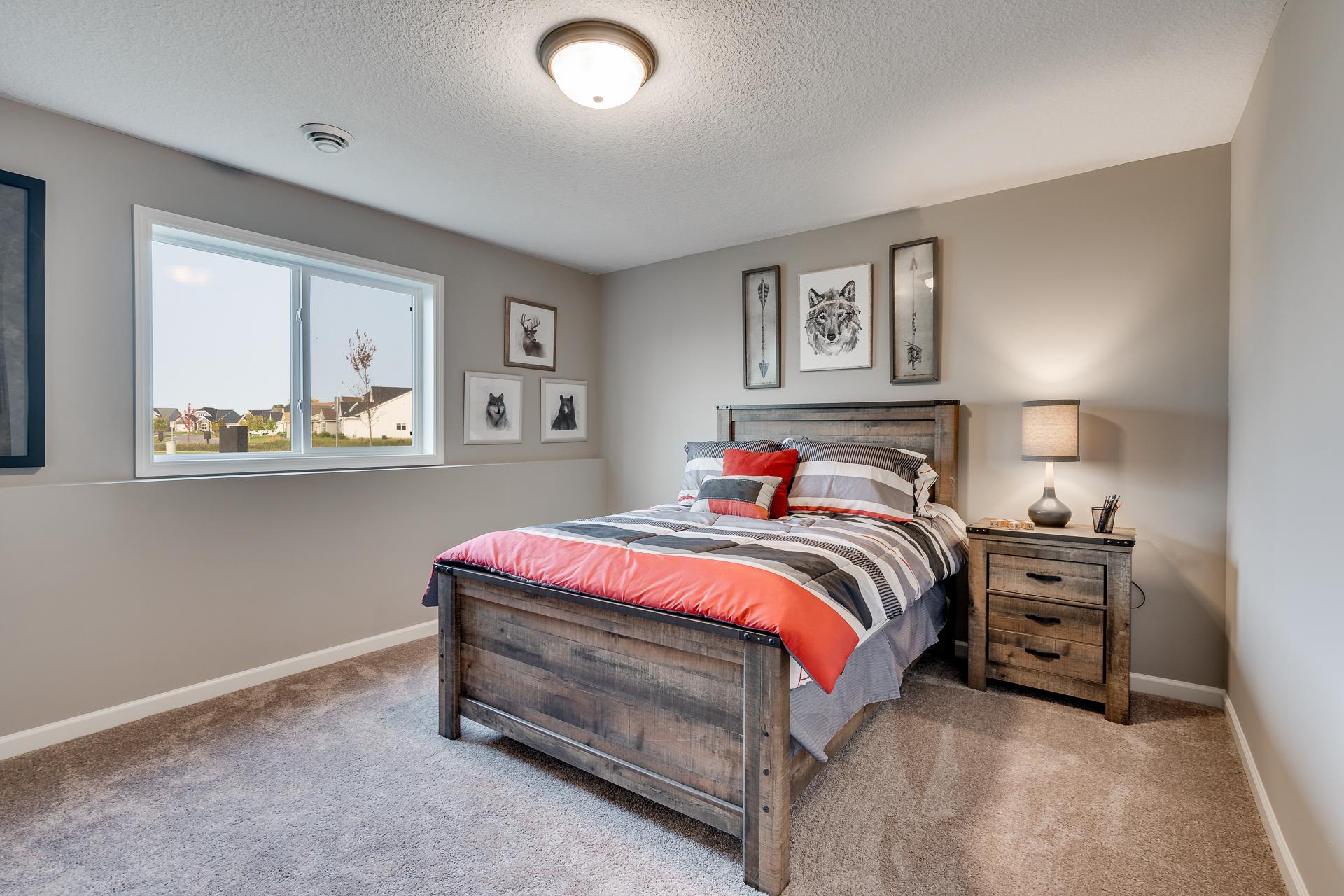 Photos are of a like home in different location. Options may be different in actual home. Actual home has no stone on the front.