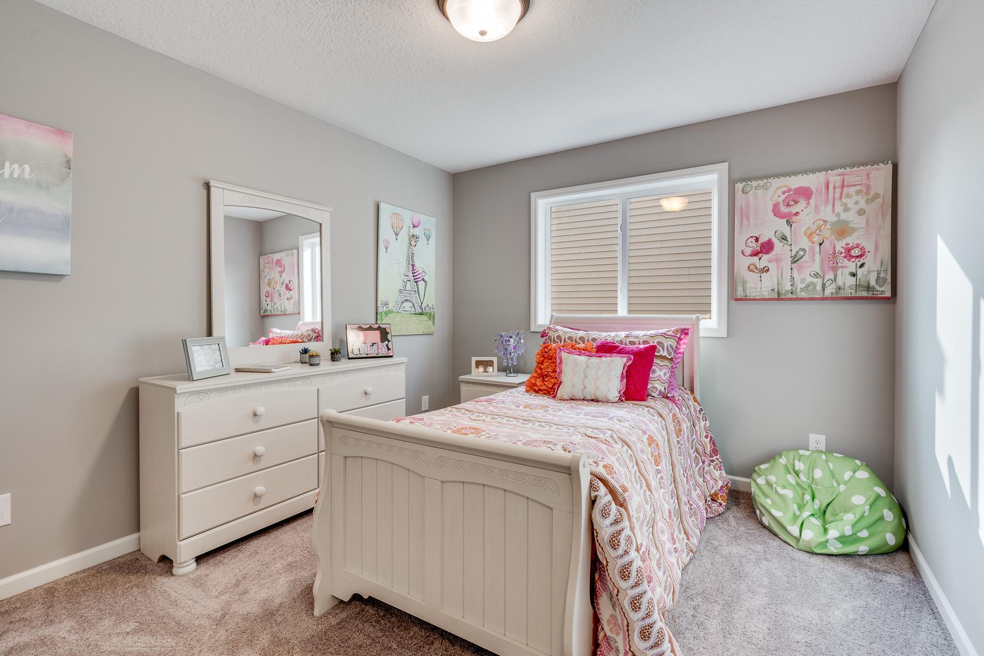 Photos are of a like home in different location. Options may be different in actual home. Actual home has no stone on the front.
