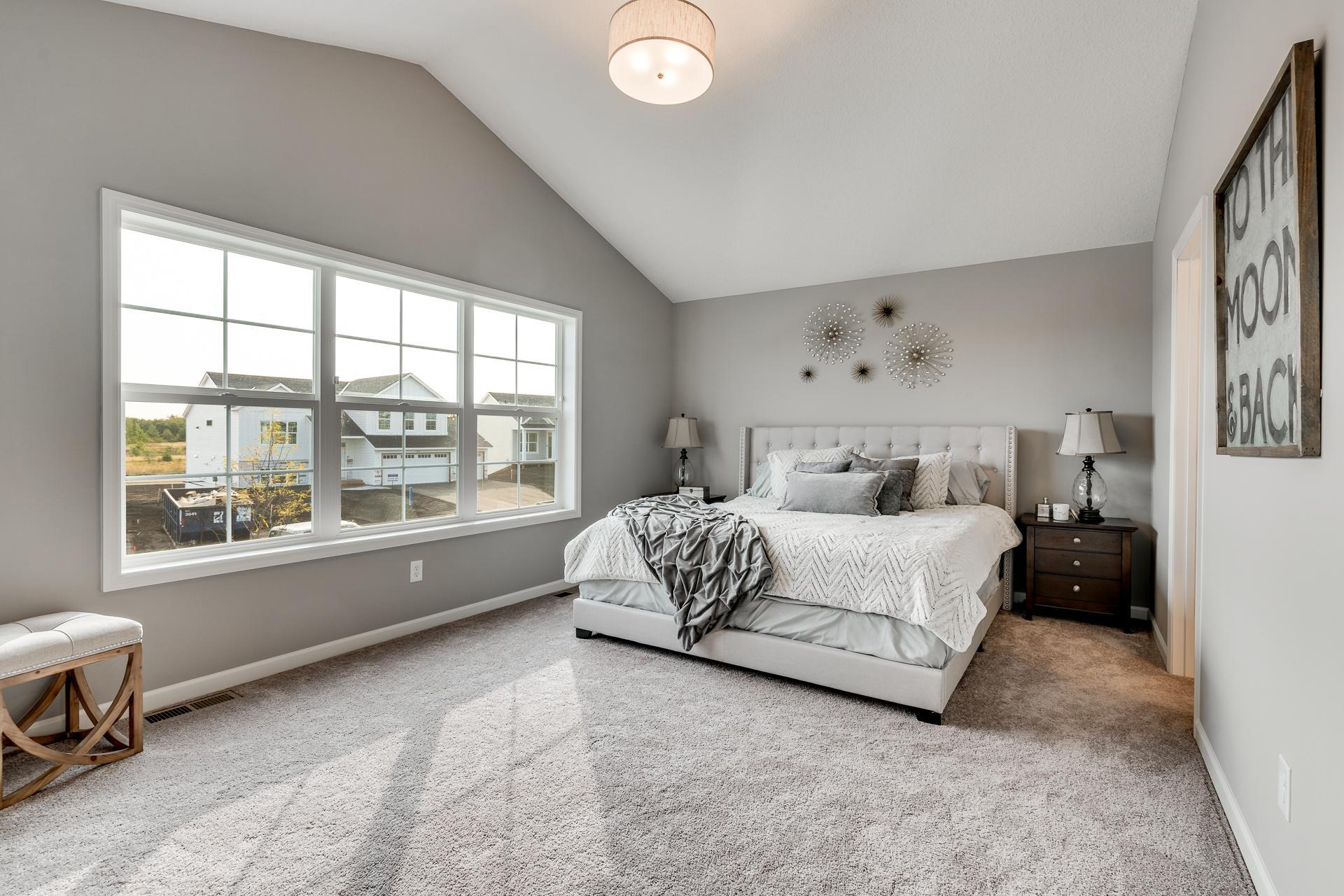 Photos are of a like home in different location. Options may be different in actual home. Actual home has no stone on the front.