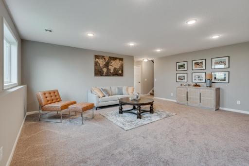 Photos are of a like home in different location. Options may be different in actual home. Actual home has no stone on the front.