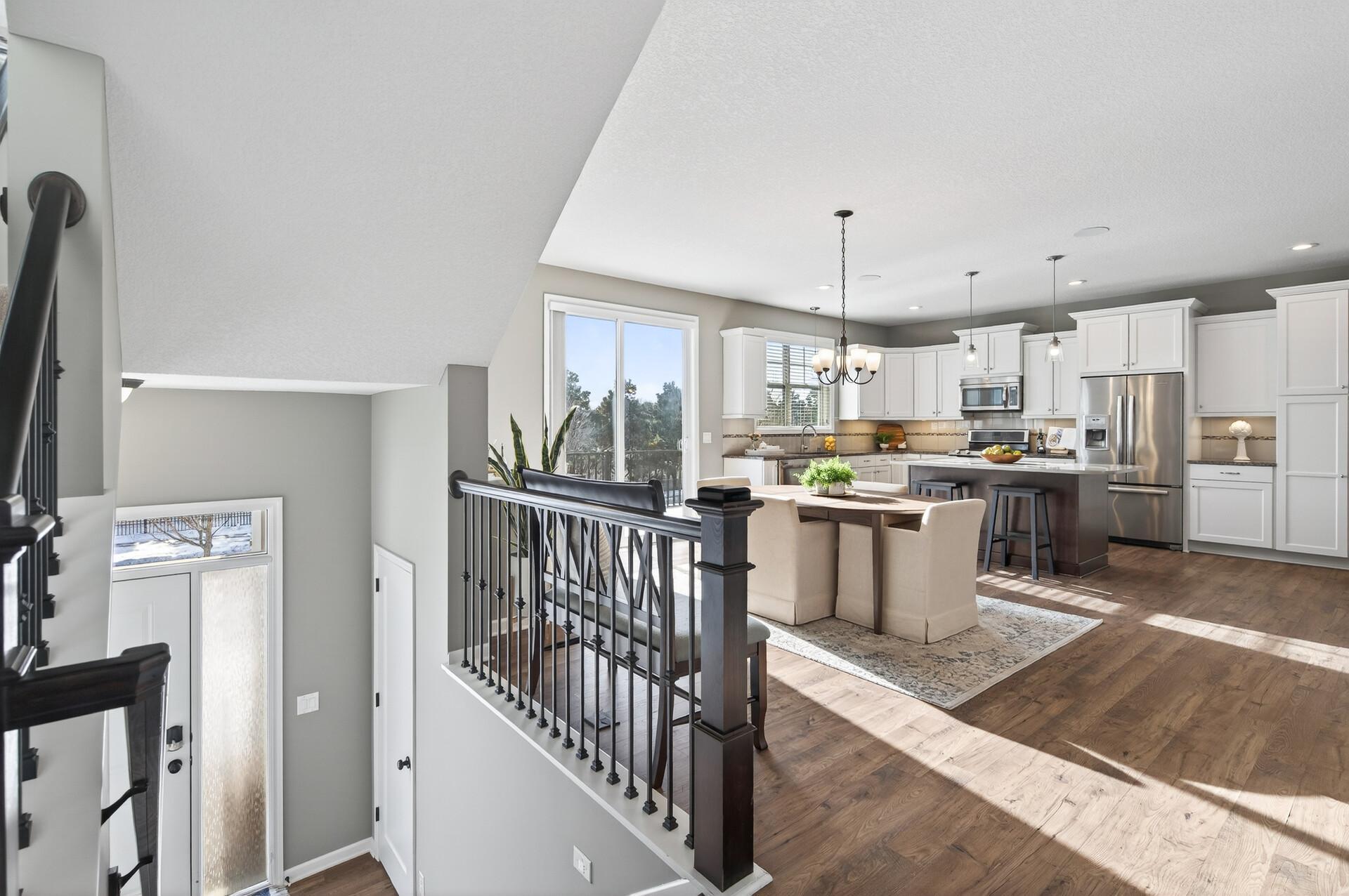 Spacious entry leads to a sun-filled dining area & kitchen