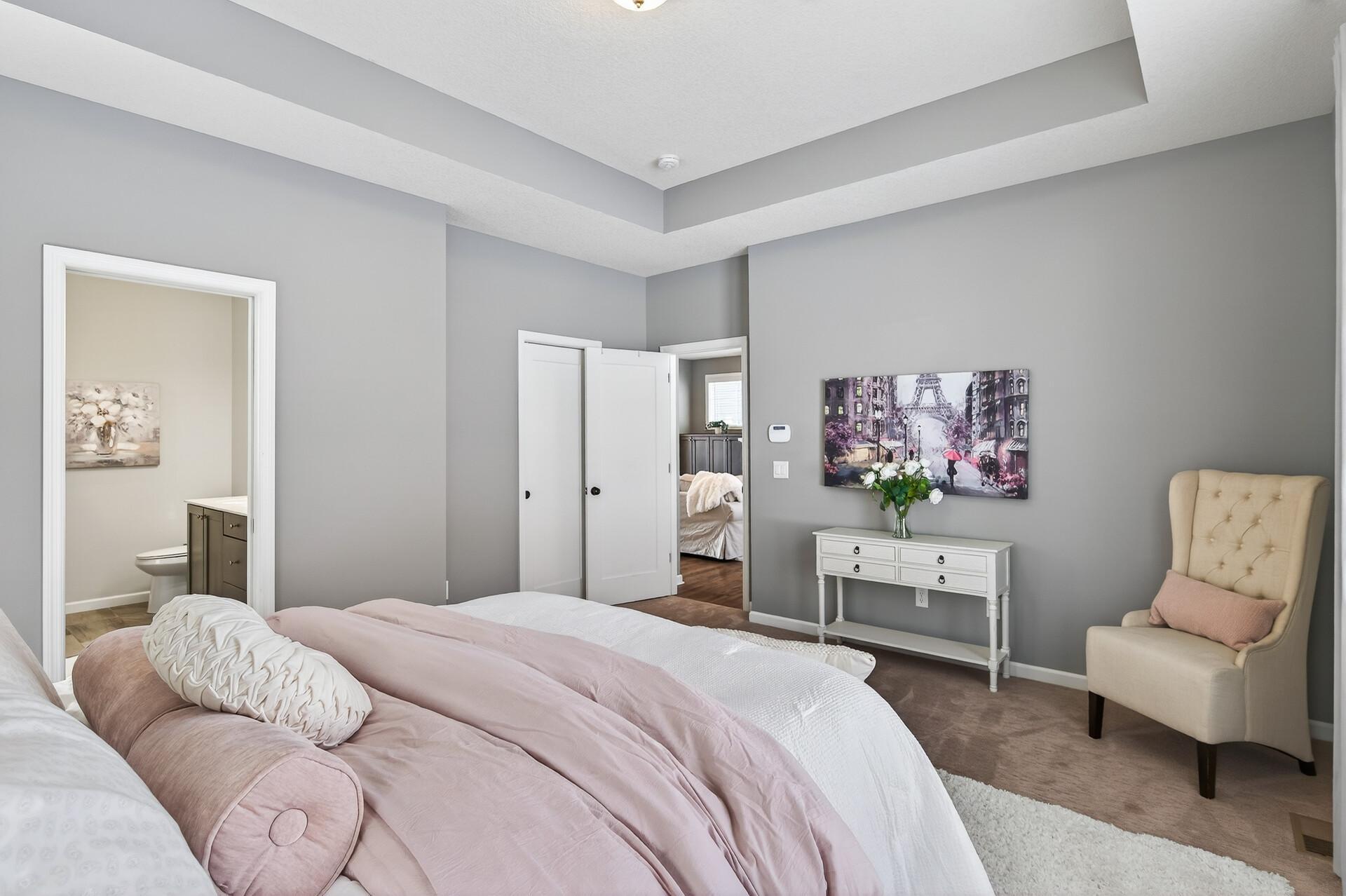 Primary bedroom has a private bath and large walk-in closet