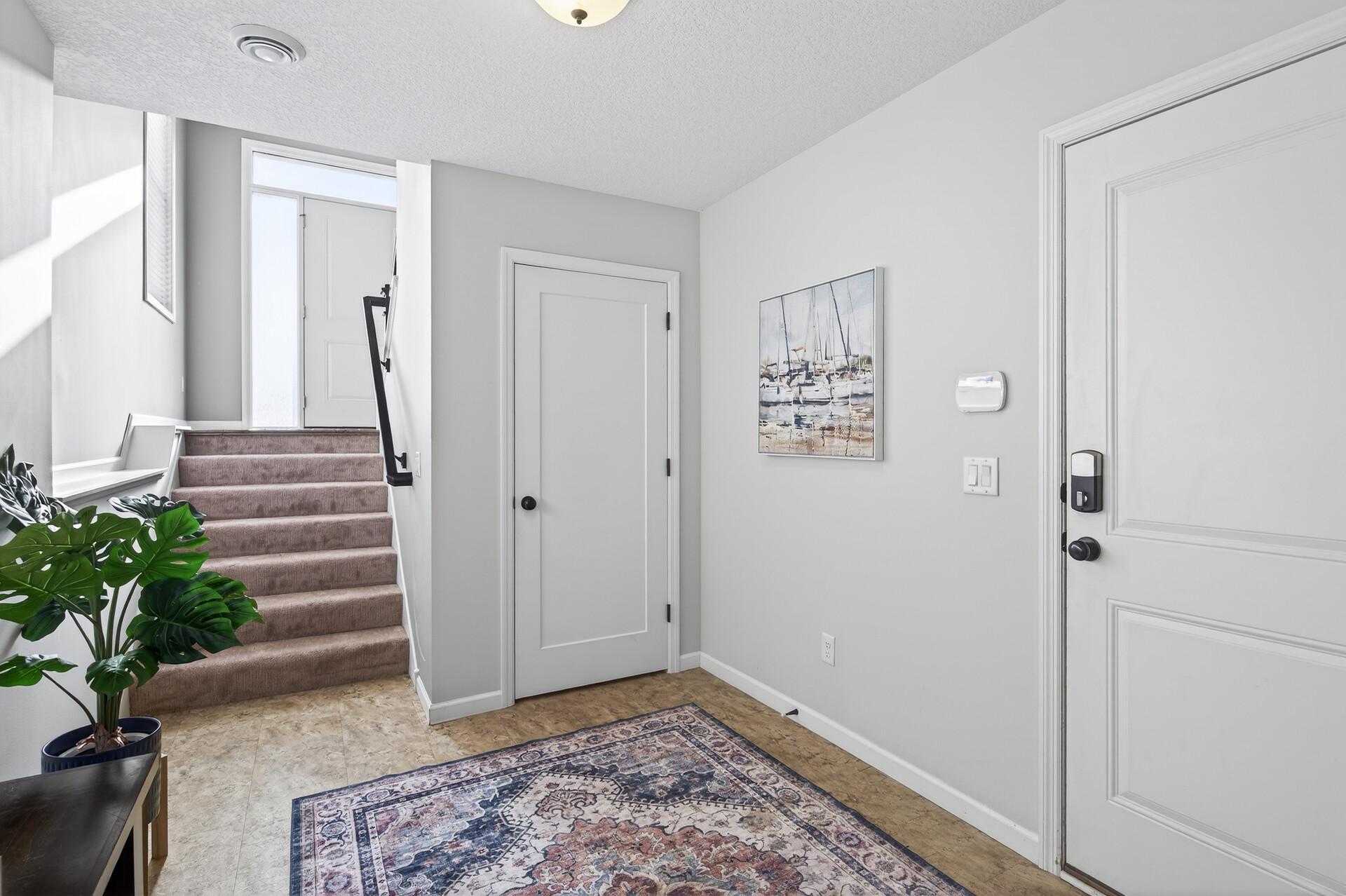Lower level entry from the garage is spacious and includes more storage space
