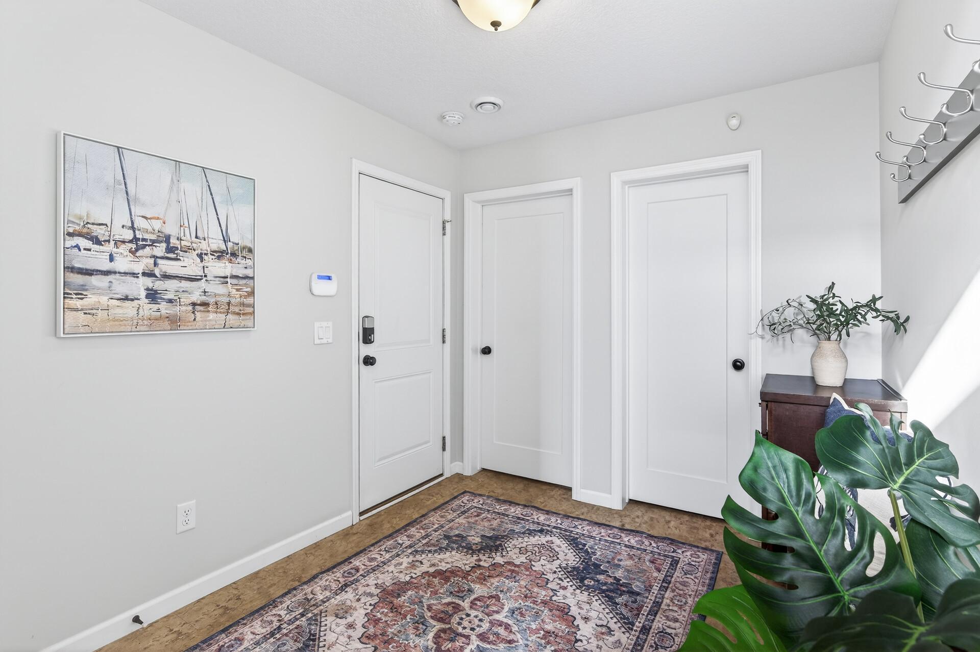Lower level entry hosts a drop zone and bench in addition to a huge walk-in closet