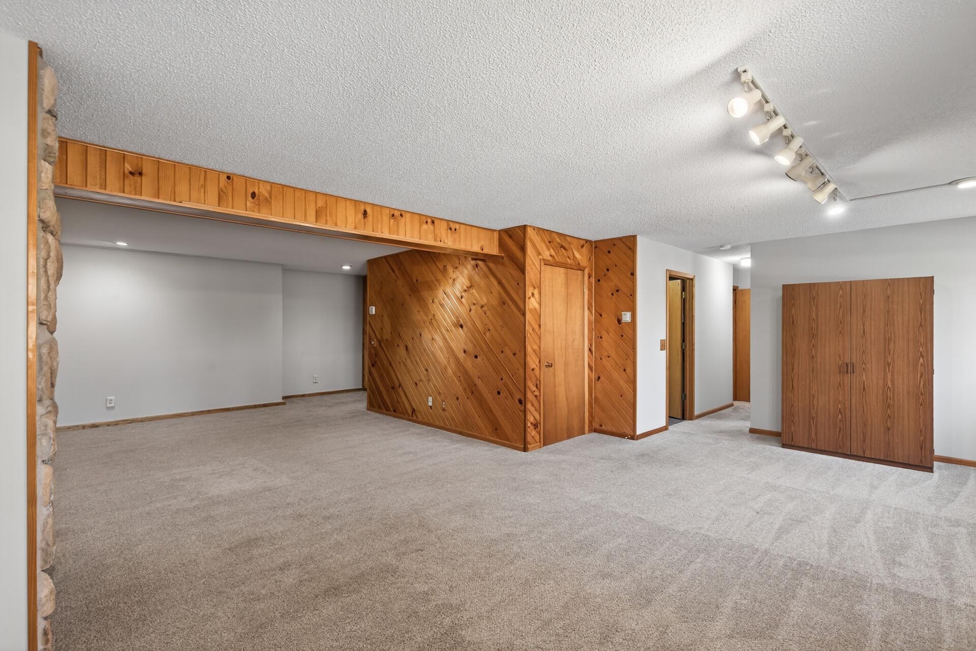 Light filled family room, fourth bedroom, and 3/4 bath.