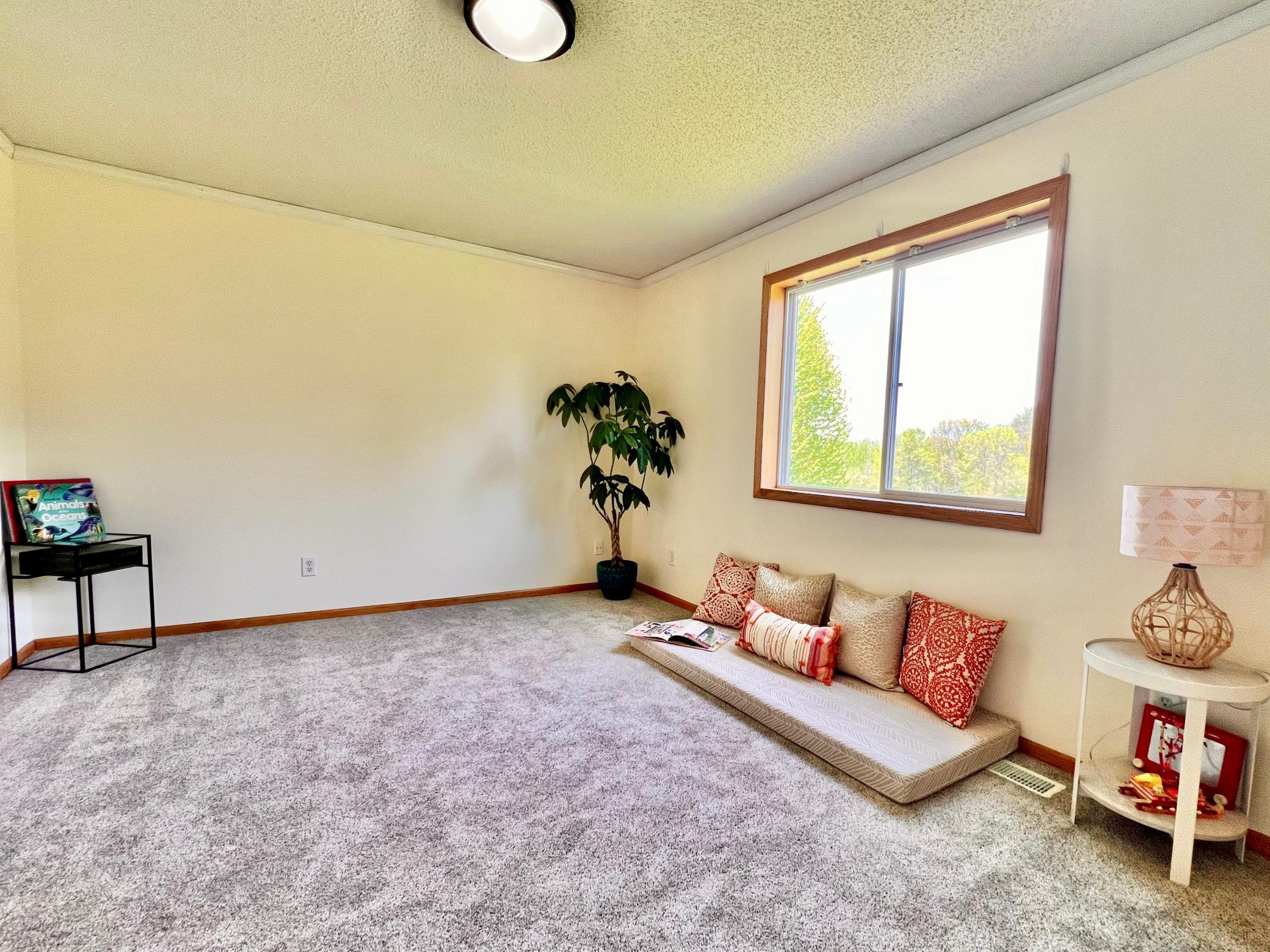 Another generously sized bedroom.