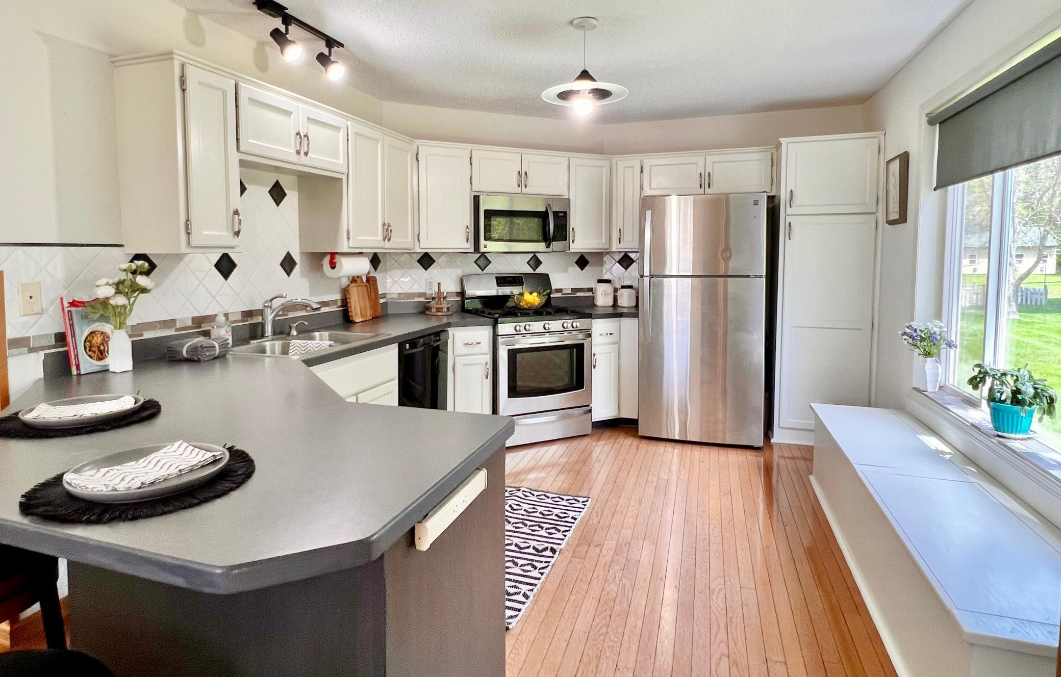 A welcoming breakfast bar creates the perfect spot for quick meals.