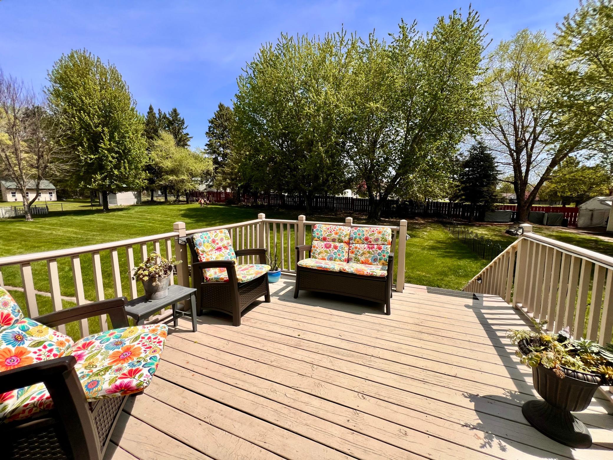 Step out to your private retreat, all that open green space, firepit, and hobby garage.