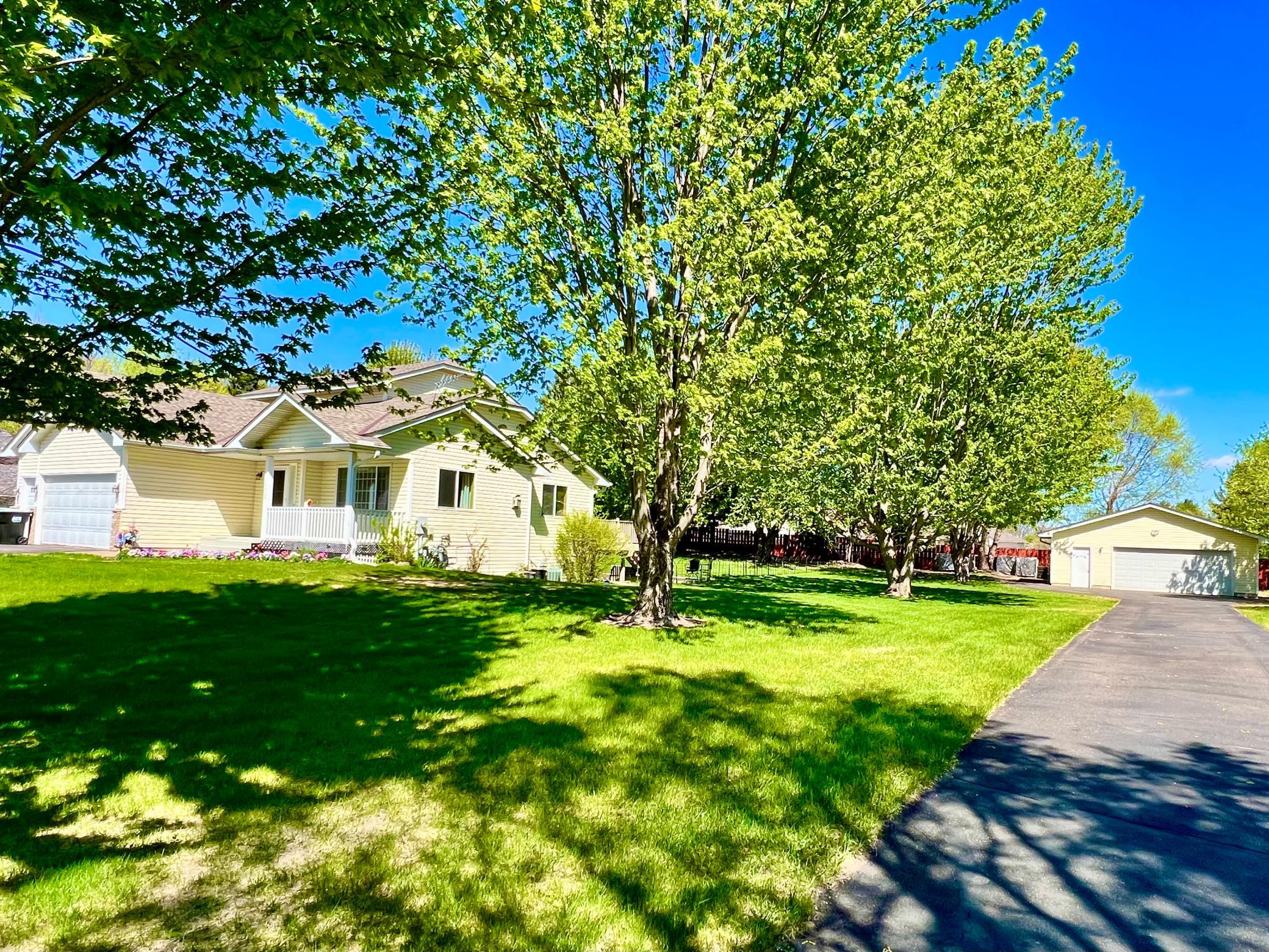 Second driveway leading to detached garage.
