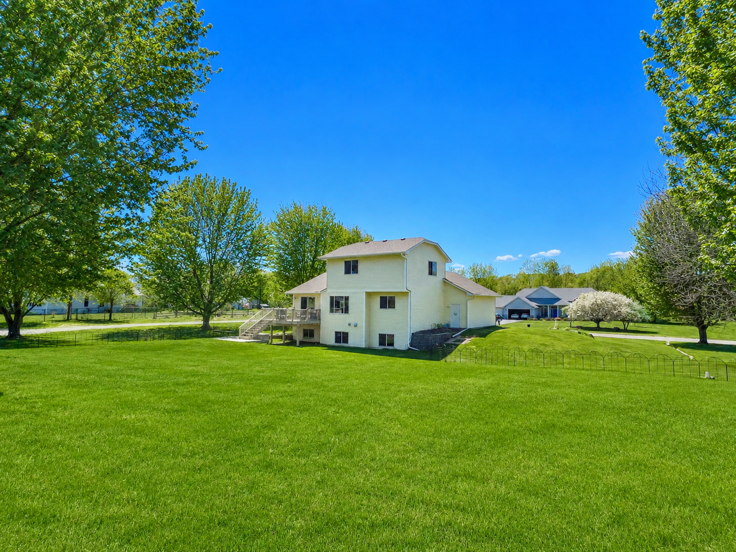 Close to 1 acre of beautifully landscaped yard has sprinkler system.