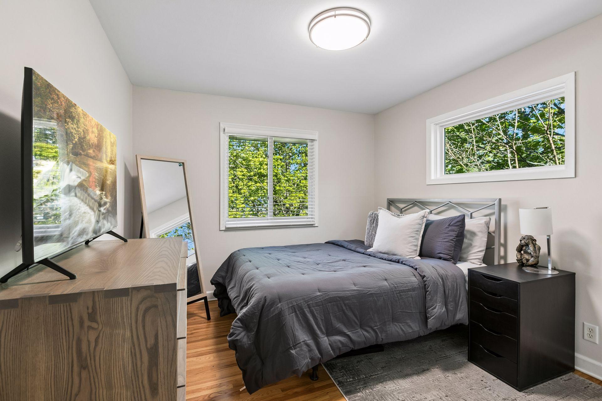 Three bedrooms on the main level (note the amazing treed views out the windows).