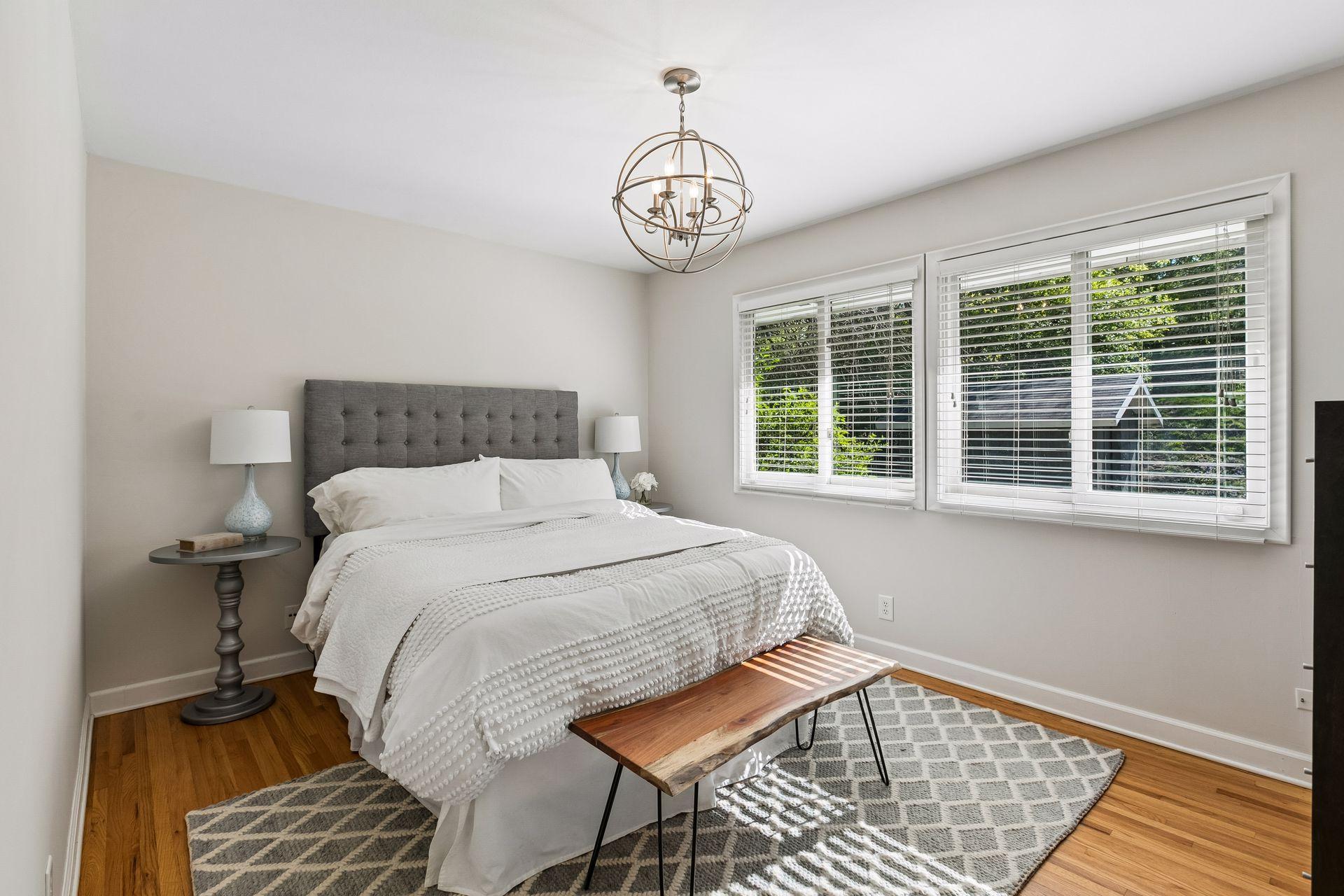 Primary bedroom overlooking the private backyard.