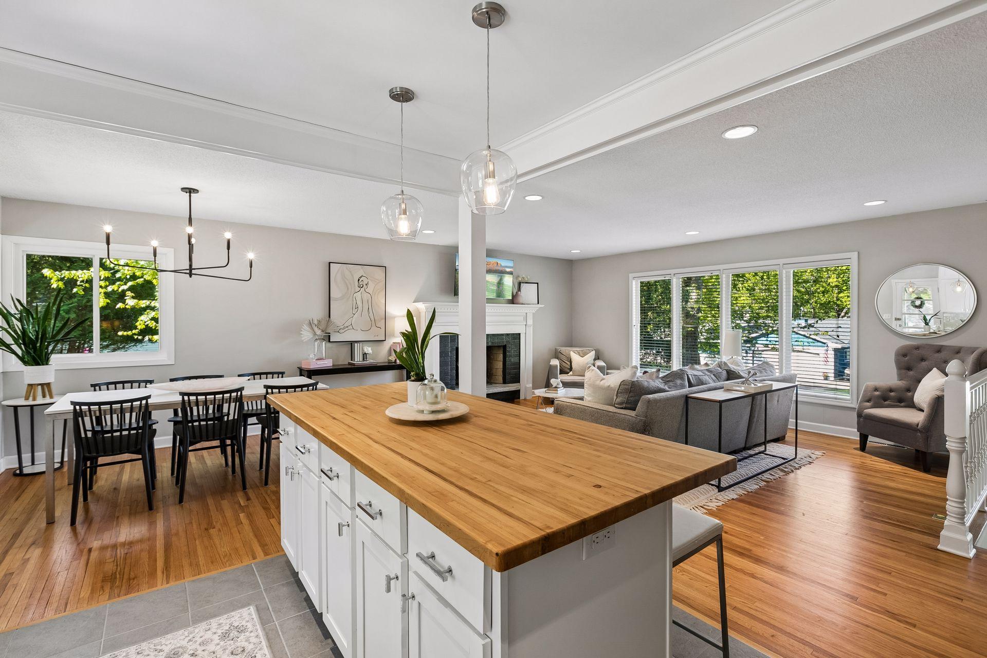 Renovated kitchen boasts a fantastic butcher-block center island-- sure to be a popular gathering spot!