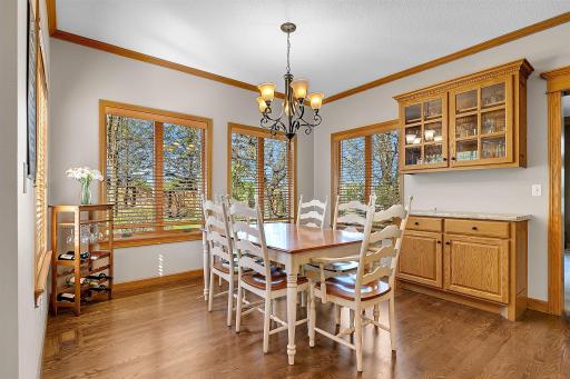 Adjacent to the kitchen is another dining space that overlooks the backyard.
