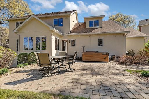 Back patio creates an outdoor living space to relax.