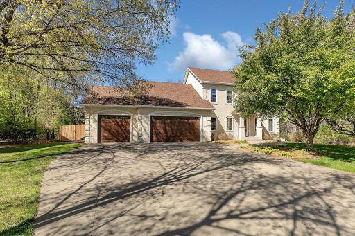 Driveway accommodates multiple vehicles.
