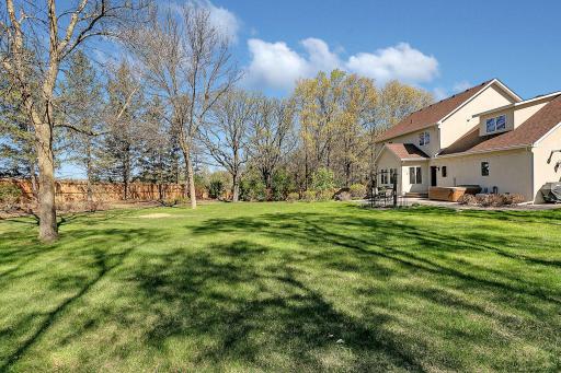 Mature trees surround the lot and shade the yard during the hot summer months.