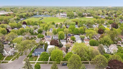 The location says it all. An aerial view of Highland Park reveals a lush tree-canopied neighborhood of beautiful homes with the rolling greens of Highland Park.