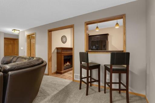 Entertain with ease at the full wet bar looking into the family
