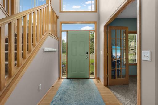 Foyer â Dramatic two-story foyer with soaring ceilings creates a bright, welcoming entrance.