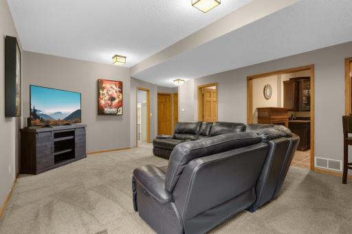 Lower level family room provides space for movie nights, game tables, or gatherings.