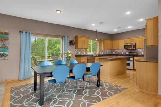 Sunny dining area with walkout access to the backyard deck.