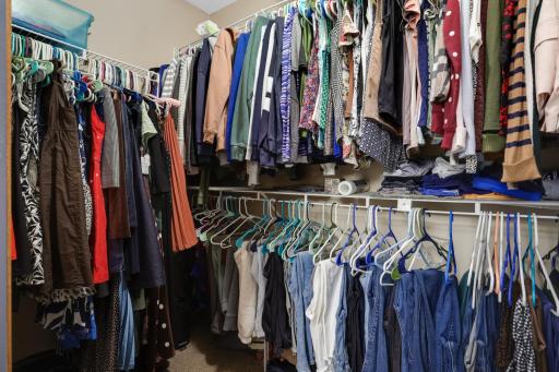 Primary bedroom large walk-in closet provides generous storage for every season.