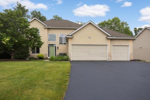 Front Exterior â Attractive curb appeal with a spacious 3-car garage and maintenance-free lifestyle.