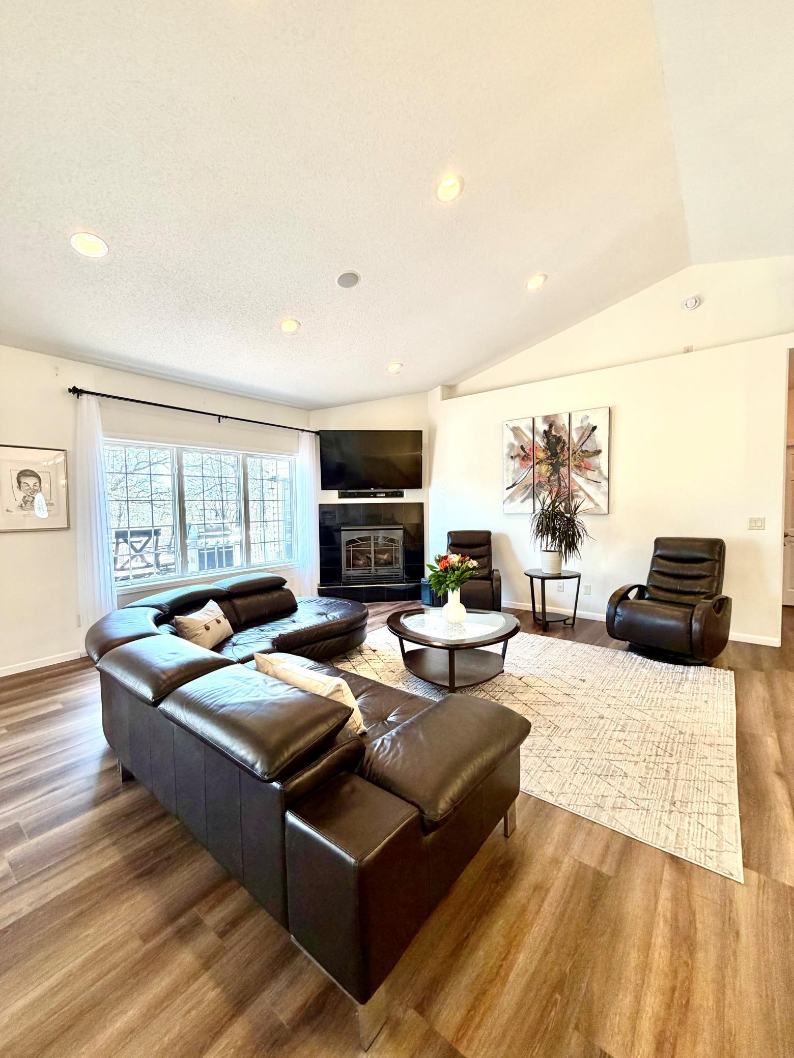 Living room with fireplace and vaulted ceiling.jpg