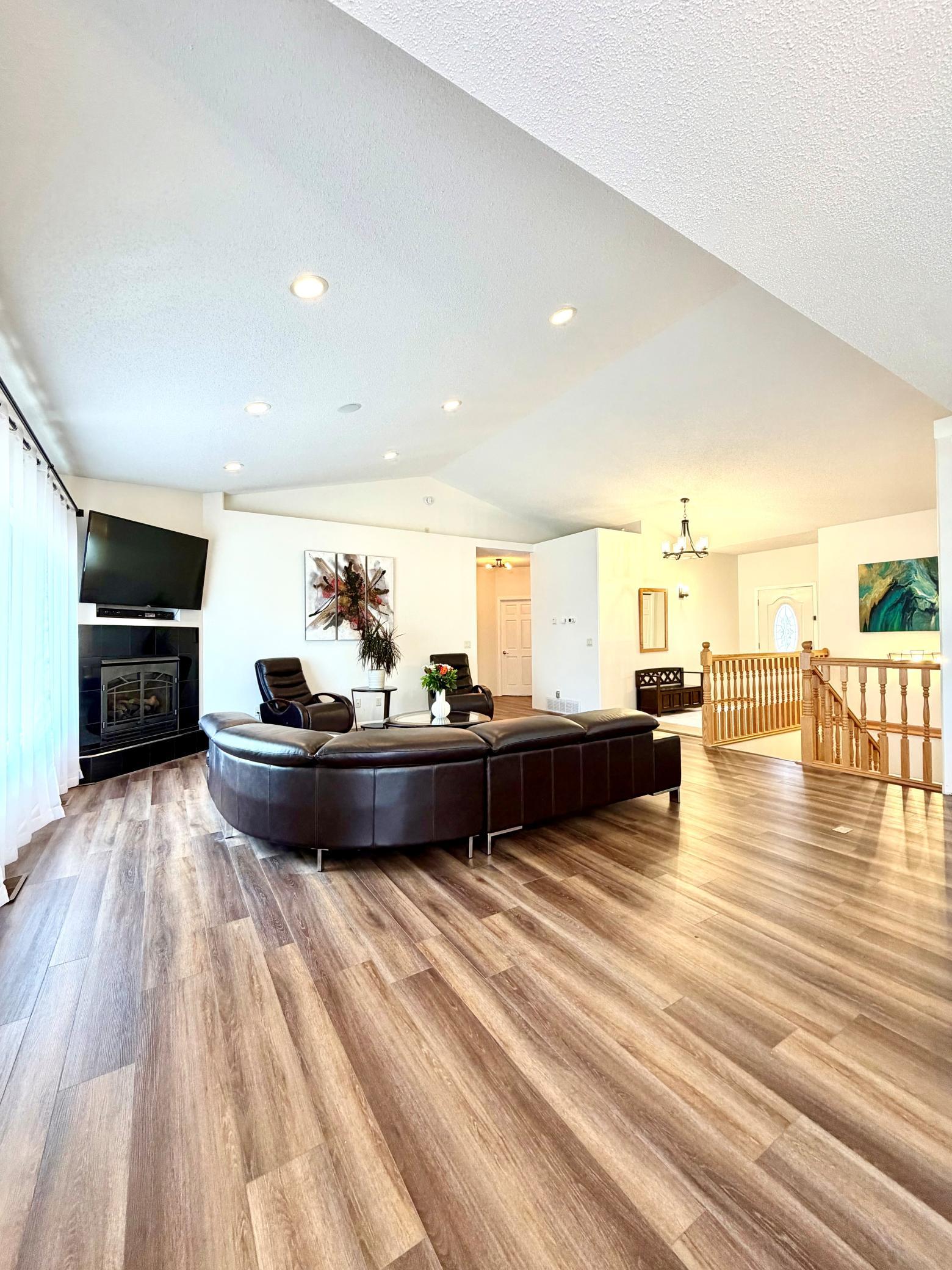 Living room with stairs to lower level.jpg