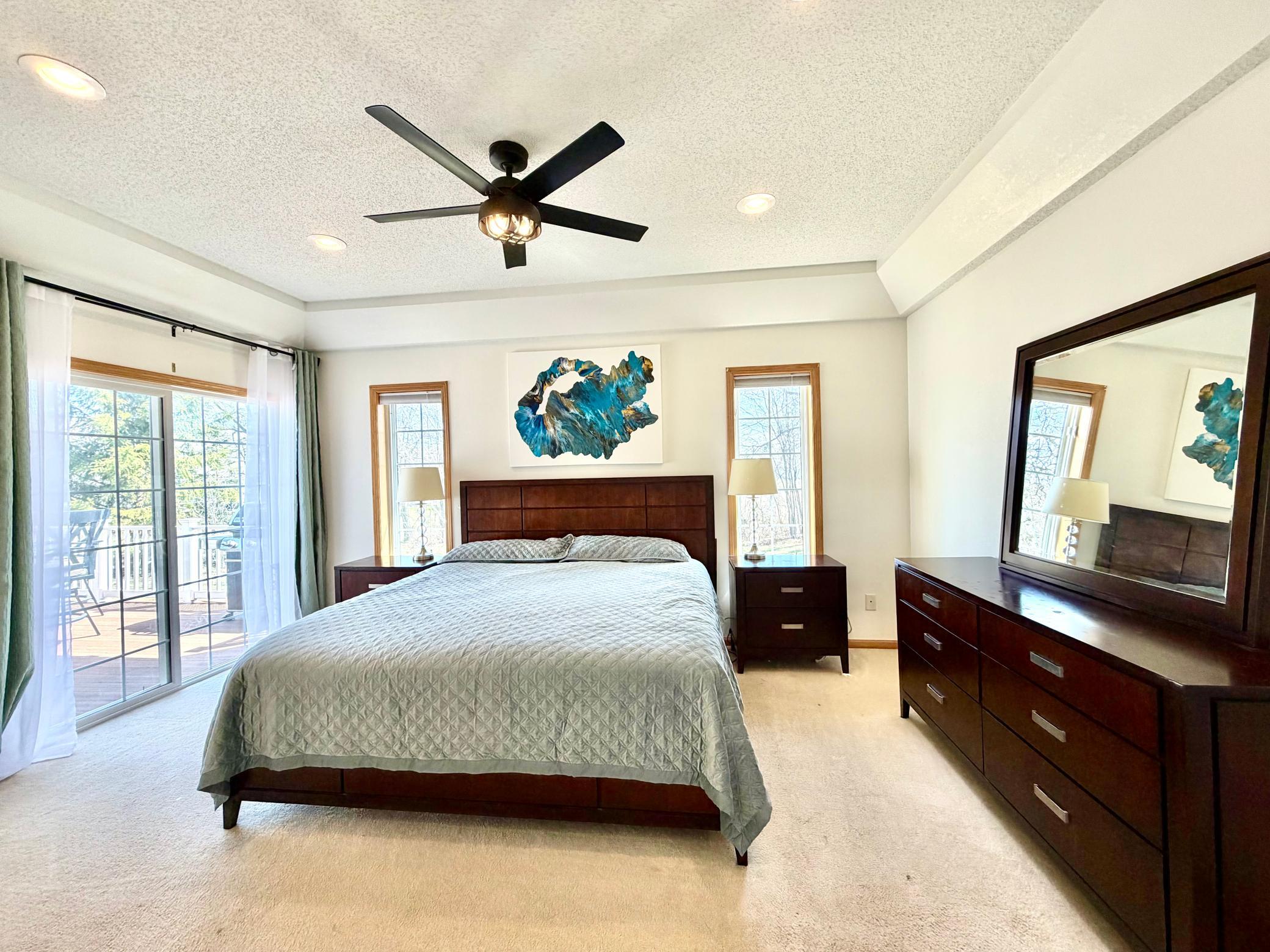 Primary bed with patio doors to deck.jpeg