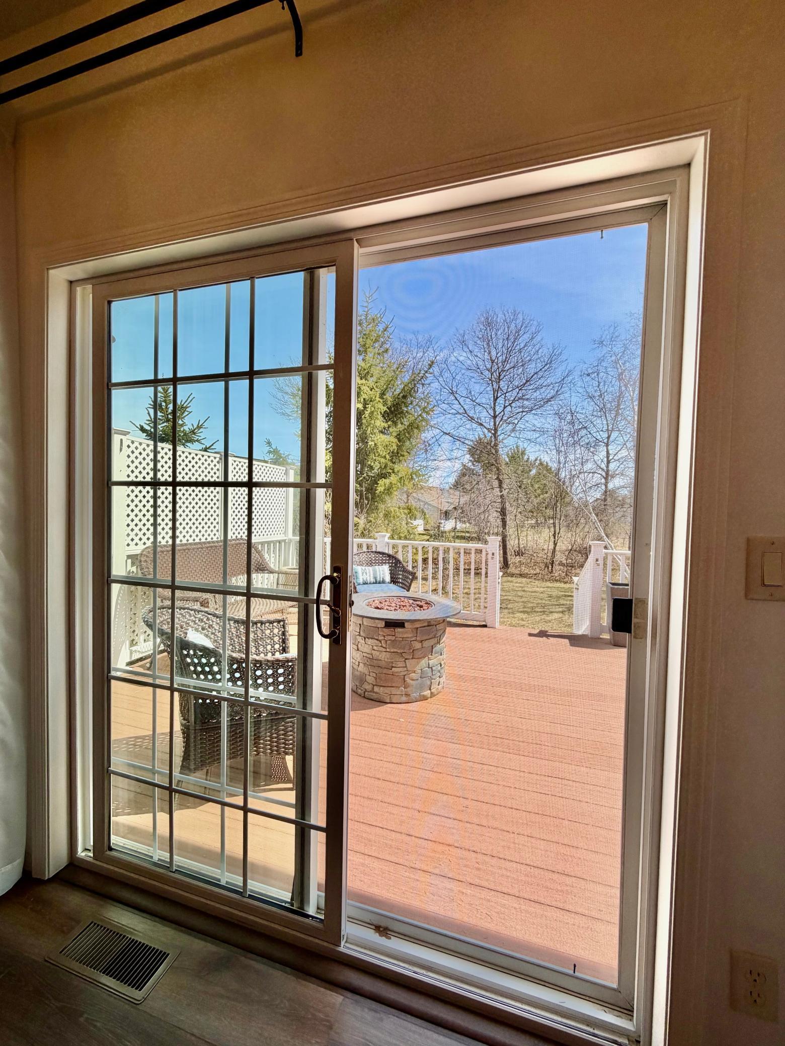 Patio doors lead to the back deck.jpeg