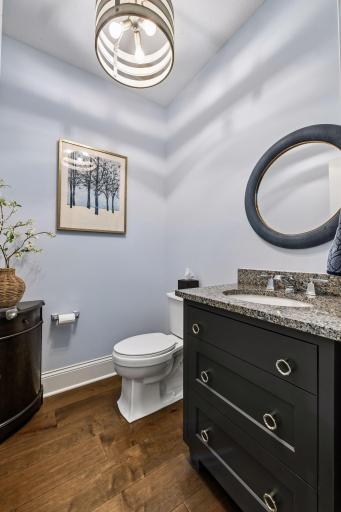 The Powder Room features a custom vanity cabinet designed to look like drawers.