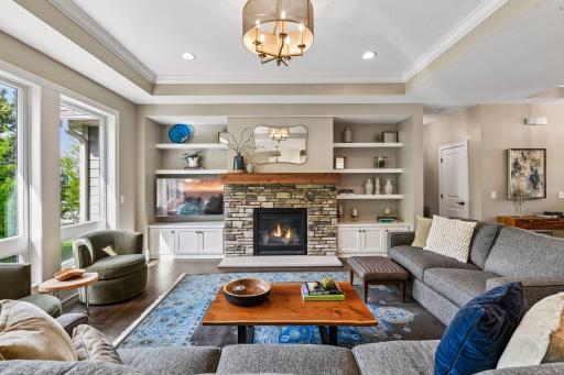 Enjoy a gas fireplace with a knotty alder mantle and flanked by custom built-ins.