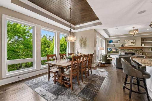 The Dining Room looks out to the treelined backyard.