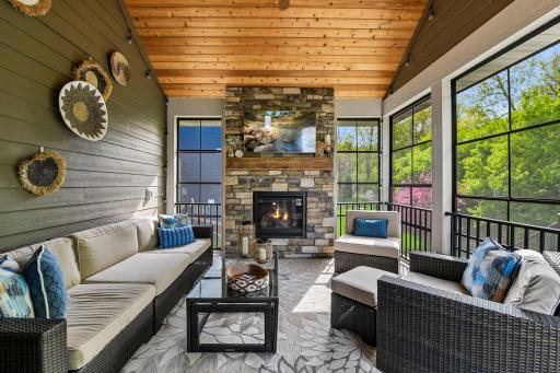 Step out to the Screen Porch - complete with an inviting gas fireplace and Sunspace windows, this room will allow you to enjoy the changing season in comfort and style.