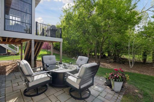 Relax by a campfire on the paver patio wile enjoying the private setting.
