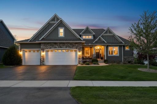 Welcome to 9264 Hawkcrest Court where you can begin your new chapter with comfortable living spaces and a peaceful setting. Image is an AI twilight shot.